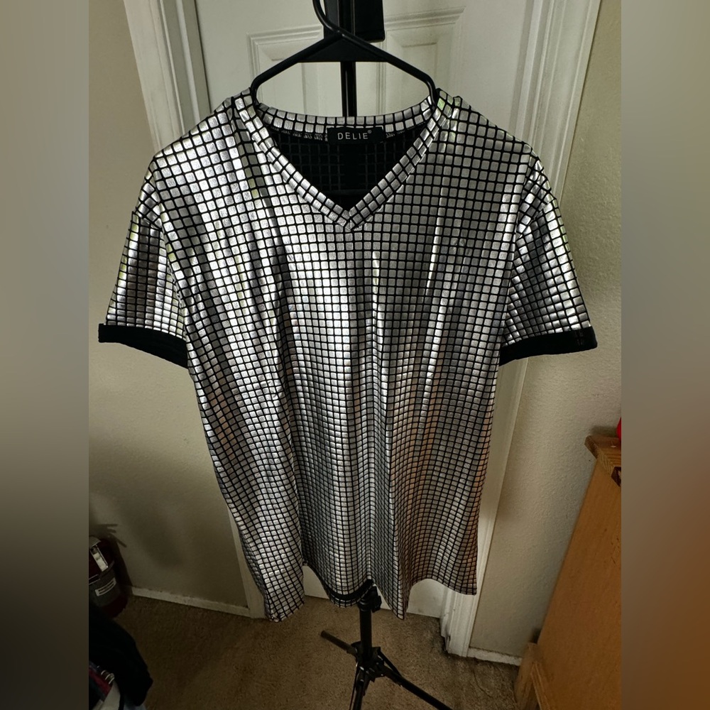 Brand new V neck shirt with a chrome look to it.